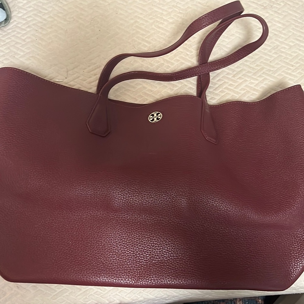 Tory Burch wine colored leather tote.